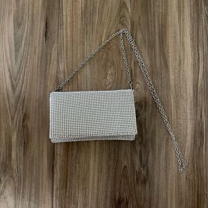 Small silver clutch with chain